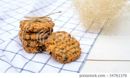 chocolate chip cookies on a white wooden table. chocolate chip cookies on a white wooden table. 34761376