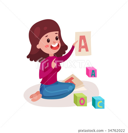 Smiling female teacher sitting on the floor Smiling female teacher sitting on the floor 34762022