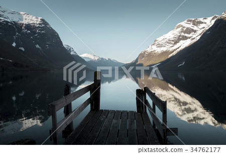 Old wooden pier at the lake in Norway Old wooden pier at the lake in Norway 34762177