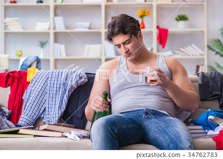 Young man student drunk drinking alcohol in a 34762783