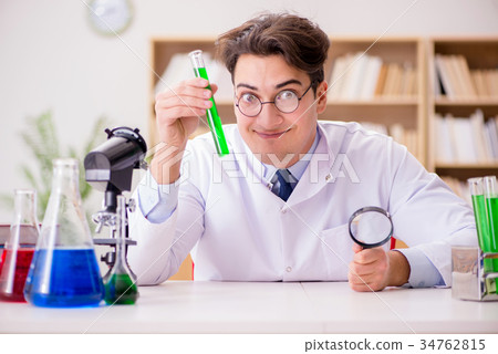 Mad crazy scientist doctor doing experiments in a 34762815