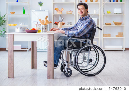 Disabled young man husband working in kitchen 34762940