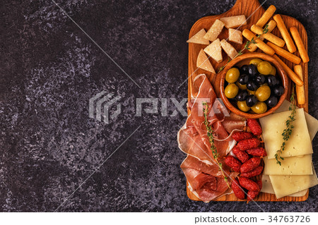 Sausage olives prosciutto cheese bread sticks. Sausage olives prosciutto cheese bread sticks. 34763726