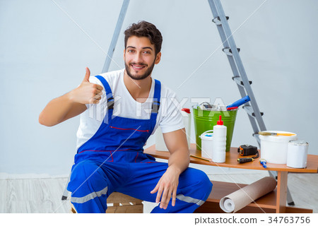 Repairman doing renovation repair in the house Repairman doing renovation repair in the house 34763756