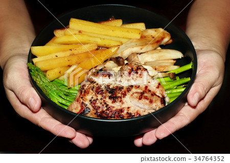 Pork steak with mixed vegetable on white dish. Pork steak with mixed vegetable on white dish. 34764352