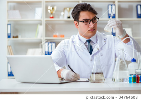 Young researcher scientist doing a water test Young researcher scientist doing a water test 34764608