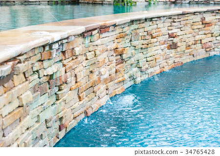 detail of beautiful swimming pool edge 34765428