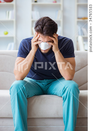 Young man recovering healing at home after plastic 34765583