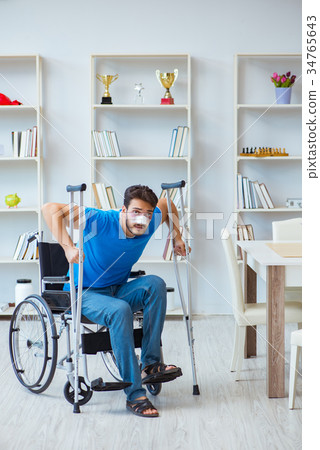 Young man recovering after surgery at home with 34765643