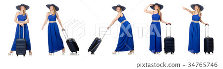 Young woman in blue dress and suitcase isolated on 34765746