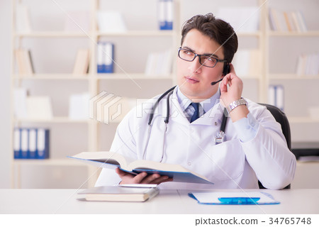 Young man doctor in medical concept Young man doctor in medical concept 34765748
