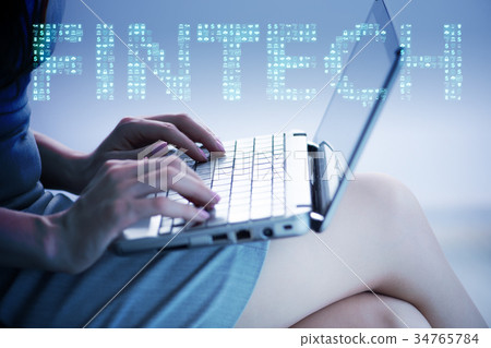 Hands working on laptop in financial technology Hands working on laptop in financial technology 34765784