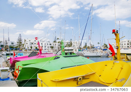Colorful catamarans in port El Kantaoui, Tunisia. Colorful catamarans in port El Kantaoui, Tunisia. 34767063
