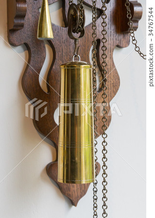 Brass weight on an old dutch clock 34767544