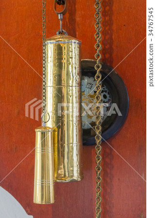 Brass weight on an old dutch clock 34767545