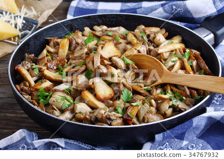 fried porcini with parsley in skillet fried porcini with parsley in skillet 34767932