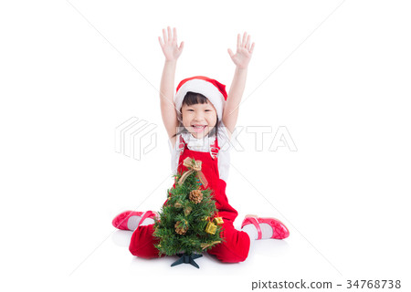 Little girl wearing santa claus red dress sitting Little girl wearing santa claus red dress sitting 34768738