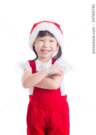 girl wearing santa claus red dress standing  34768740