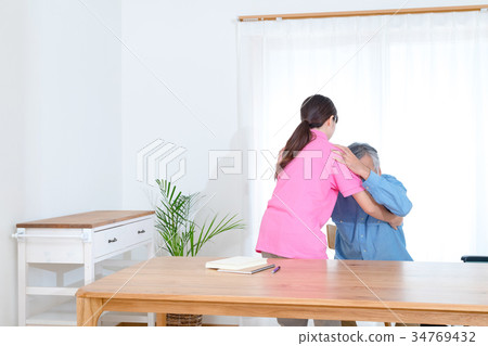 Female carer helping old man Nursing home Day care center Wheelchair Female carer helping old man Nursing home Day care center Wheelchair 34769432