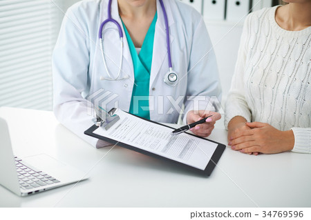 Doctor and patient, close-up of hands.  Physicia 34769596