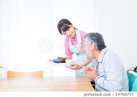 Young carer and grandpa enjoy meal conversation assistance nutrition management nursing home day care center Young carer and grandpa enjoy meal conversation assistance nutrition management nursing home day care center 34769737