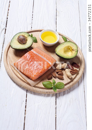 Healthy food vegetables , nuts and salmon 34772151