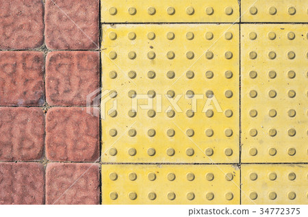 Tactile Paving Slabs on the Sidewalk Tactile Paving Slabs on the Sidewalk 34772375