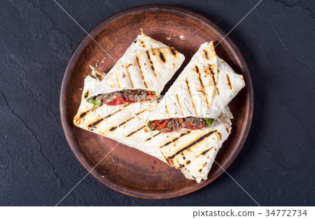 Homemade tasty burrito Homemade tasty burrito 34772734