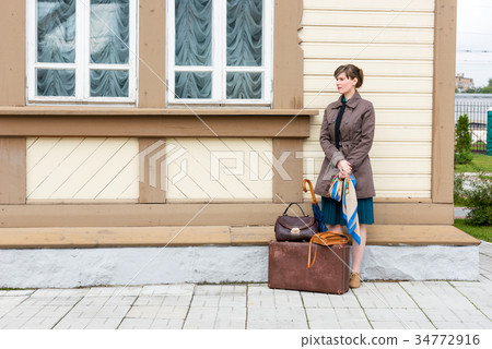 young woman waiting for train at station young woman waiting for train at station 34772916