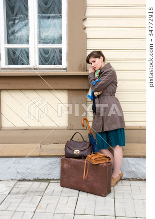 young woman waiting for train at station young woman waiting for train at station 34772918