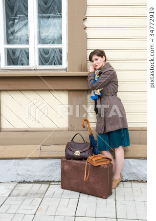 young woman waiting for train at station young woman waiting for train at station 34772919