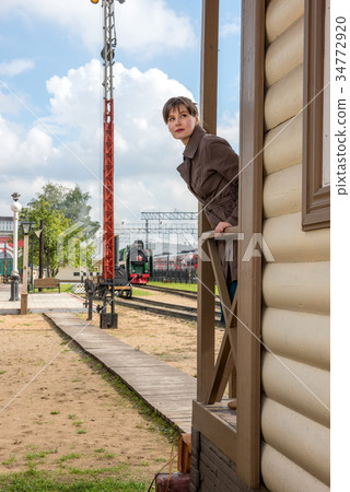 young woman waiting for train at station young woman waiting for train at station 34772920