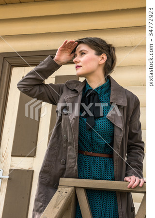 young woman waiting for train at station young woman waiting for train at station 34772923