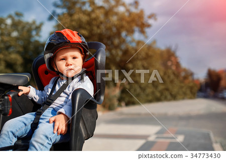 cute happy little baby on bike seat cycling in cute happy little baby on bike seat cycling in 34773430