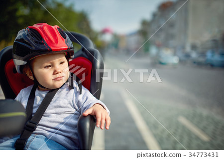 cute happy little baby on bike seat cycling in cute happy little baby on bike seat cycling in 34773431