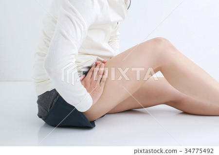 Woman touching the groin 34775492