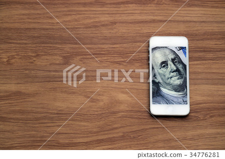 Dollar cash money in smartphone, fintech business Dollar cash money in smartphone, fintech business 34776281