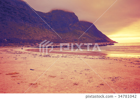 Fjord, rocky beach with white sand at sunset 34781042