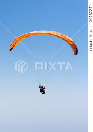 Sky Diving with space in solid blue sky Sky Diving with space in solid blue sky 34782254