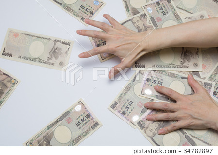 Large amount of money collected 10,000 yen bill 34782897
