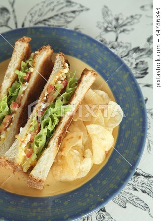 Sandwiches with French fried and coffee for breakf Sandwiches with French fried and coffee for breakf 34786343