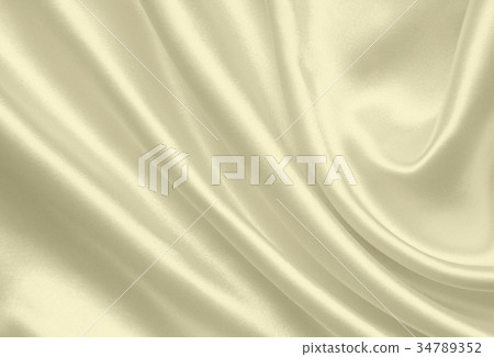 Smooth elegant golden silk as wedding background Smooth elegant golden silk as wedding background 34789352