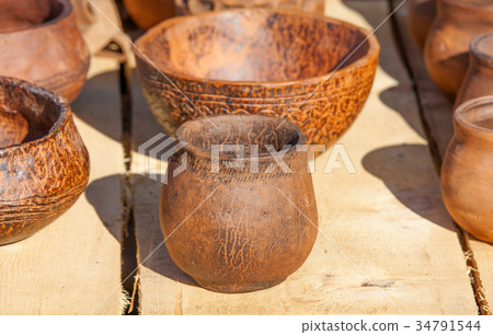vintage pottery on wooden surface. 34791544