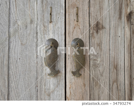 Fish door handle on the wood. Fish door handle on the wood. 34793274
