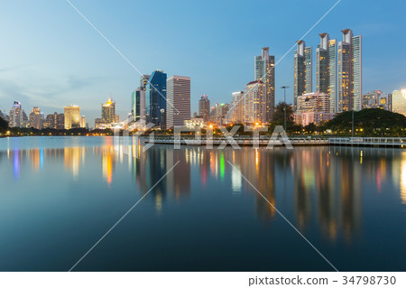 Twilight office building in public park 34798730