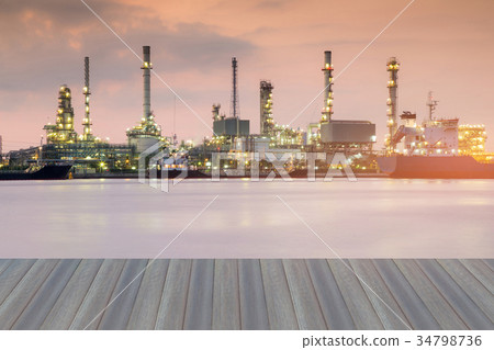Oil refinery river front at twilight 34798736