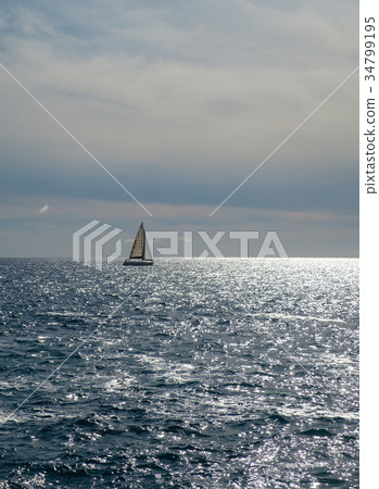 sail boat at horizon line 34799195
