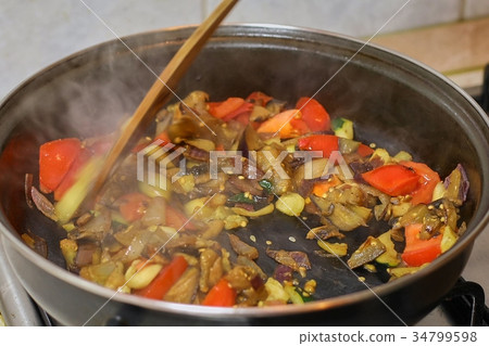 Preparing hot breakfast 34799598