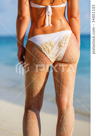 Young woman on the beach 34801185