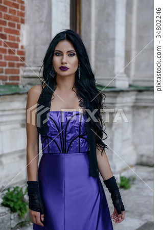Beautiful witch in lilac dress Beautiful witch in lilac dress 34802246